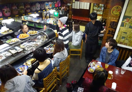 The store is crowded with many people.